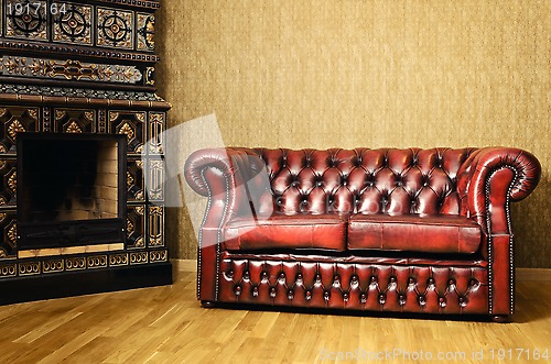 Image of Sofa Near The Fireplace