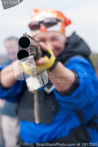 Image of woman aiming a gun