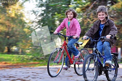 Image of Happy children riding bikes