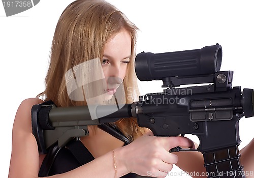 Image of beautiful young woman aiming