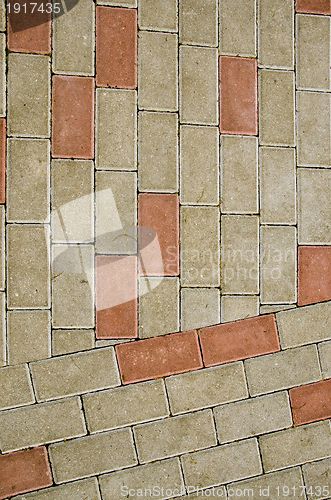 Image of City sidewalk lined with small tile background 