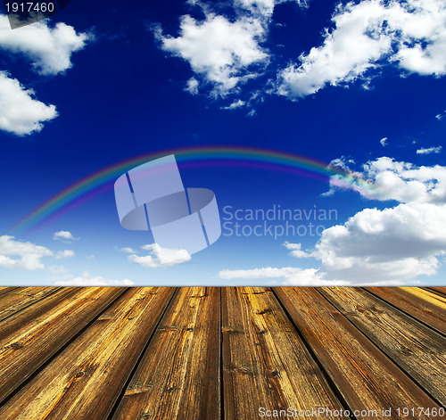 Image of blue sky and wood floor background