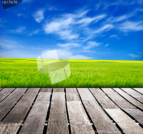 Image of blue sky and wood floor background