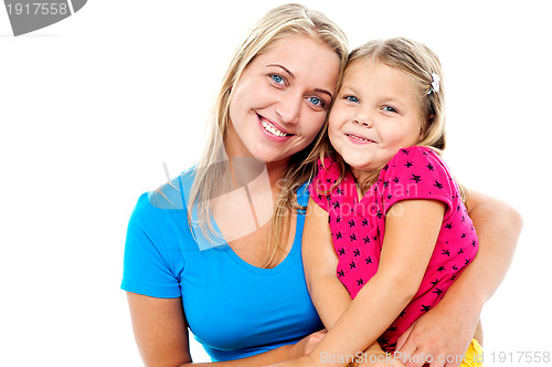 Image of Adorable mom and daughter posing together