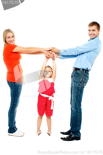 Image of Cheerful family having fun indoors