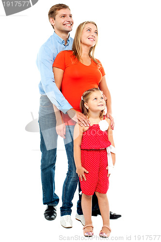 Image of Couple with their girl child looking upwards