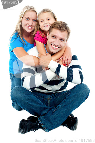 Image of Happy young family, the adorable three