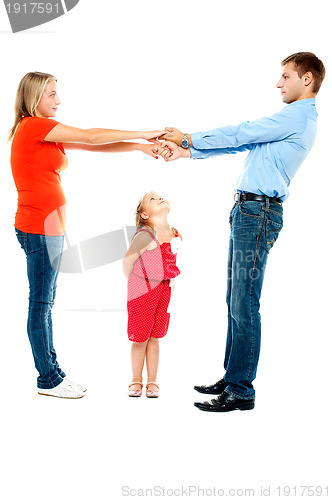 Image of Playful family of father, mother and daughter