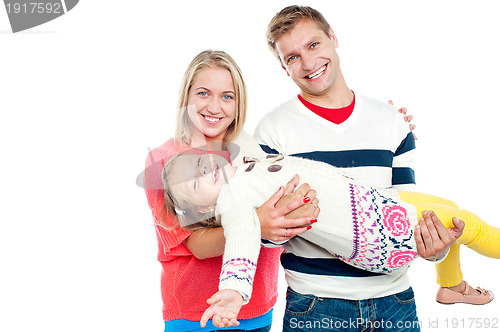 Image of Excited daughter having fun in safe hands of her parents