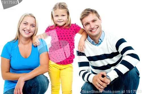 Image of Gorgeous couple posing with beautiful girl child