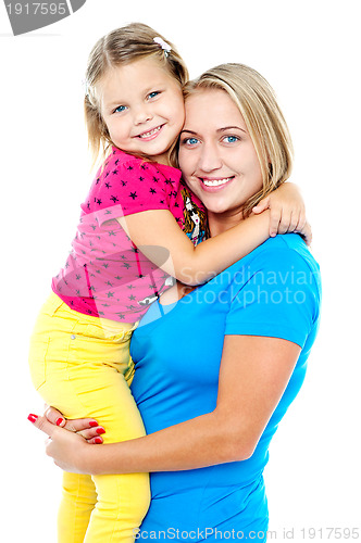 Image of Cute daughter hugging her mom. Casual shot
