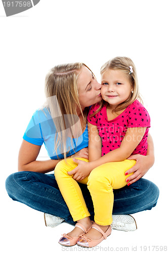 Image of Beautiful mom kissing her pretty daughter