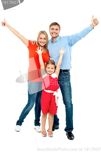 Image of Beautiful smiling family. Father, mother and daughter