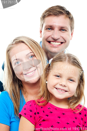 Image of Husband posing with his adorable wife and daughter