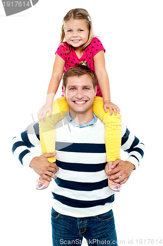 Image of Fun loving kid sitting on her father's shoulders