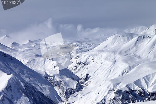 Image of Snowy mountains in haze