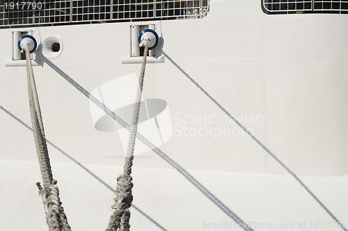 Image of Ship ropes and moored ship