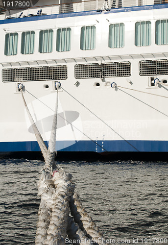 Image of Ship ropes and moored ship