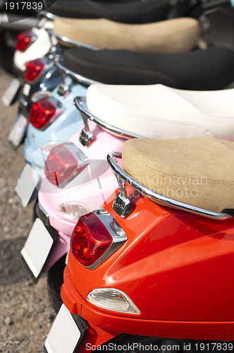 Image of A line of mopeds/scooters