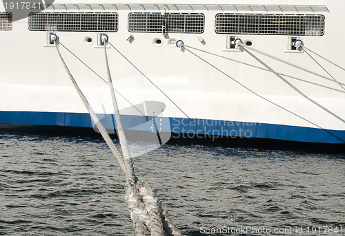 Image of Ship ropes and moored ship