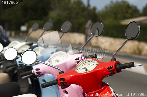 Image of A line of mopeds/scooters