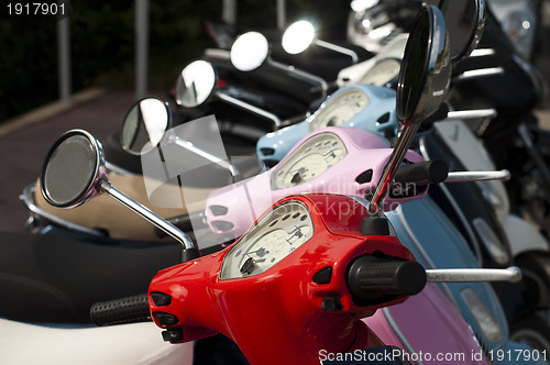 Image of A line of mopeds/scooters