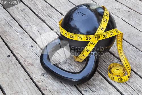 Image of kettlebell and measuring tape