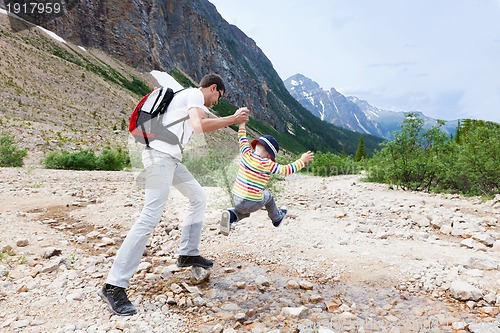 Image of father and his son hiking