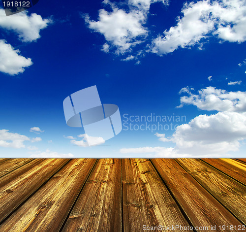 Image of blue sky and wood floor background