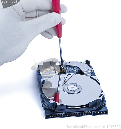 Image of technician with open hard-disk