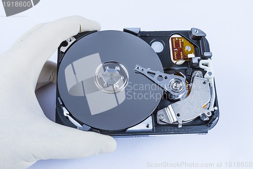 Image of technician with open hard-disk