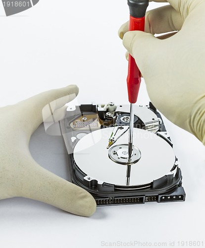 Image of technician with open hard-disk
