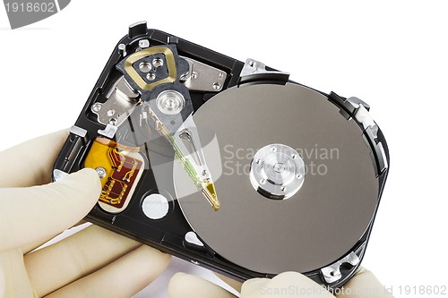 Image of technician with open hard-disk