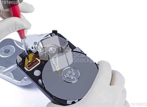 Image of technician with open hard-disk