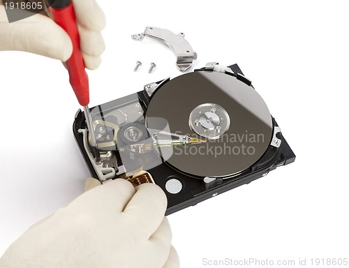 Image of technician with open hard-disk