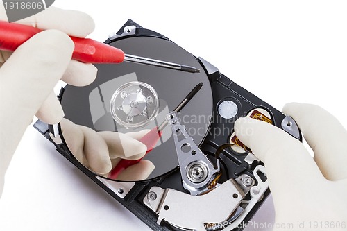 Image of technician with open hard-disk