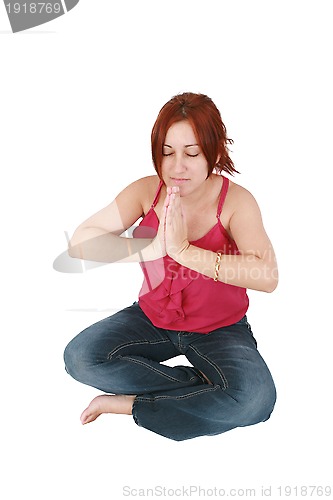 Image of Calm woman doing relaxing yoga exercises 