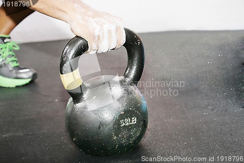 Image of kettlebell crossfit workout on the gym