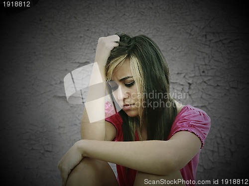 Image of portrait of a sad teenage girl looking thoughtful about troubles