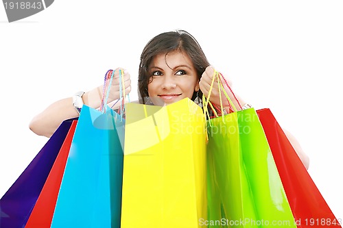 Image of Beautiful shopping woman holding bags isolated over white backgr