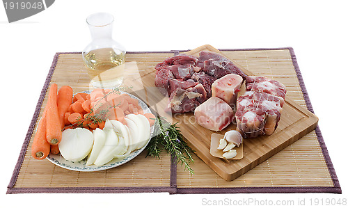 Image of variety of meat, vegetables and wine