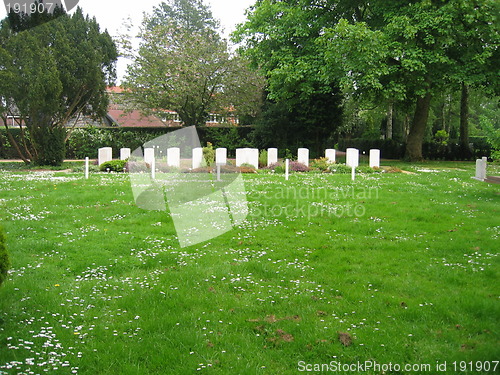 Image of white gravestones in distance