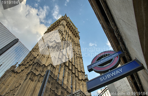 Image of LONDON - SEP 27 : The 'Underground' sign and 'Big Ben' tower at 