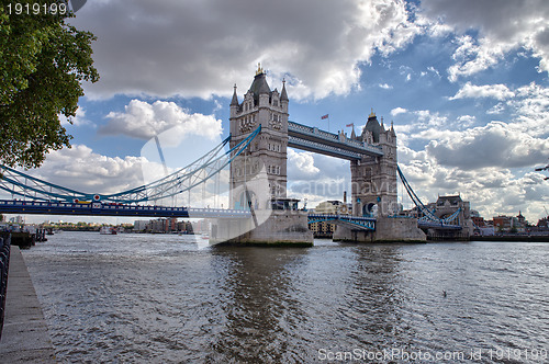 Image of Side view of Tower Bridge with river Thames, London
