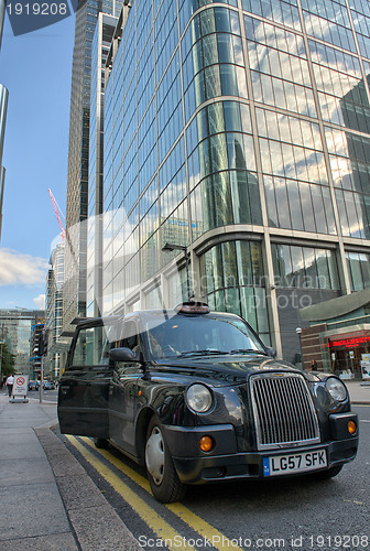 Image of LONDON - SEP 27: A taxi awaits for customer to come inside in Ca