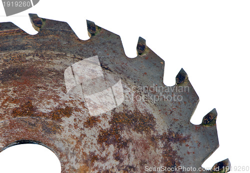 Image of Retro rusty circular saw disk closeup on white 