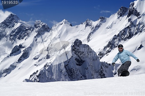 Image of Snowboarding in high mountains