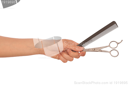 Image of scissors and hairbrush