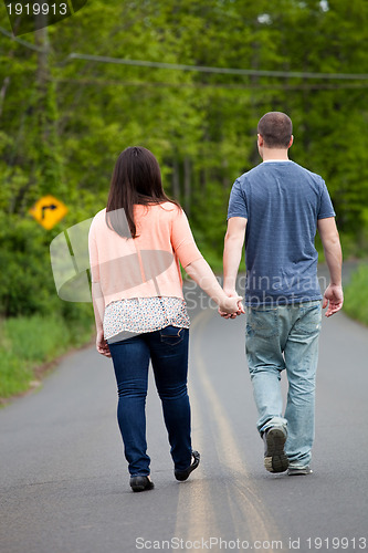 Image of Couple Walking Down the Road Together