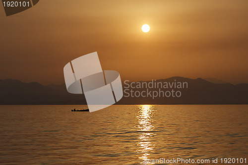 Image of Fisherman sailing home